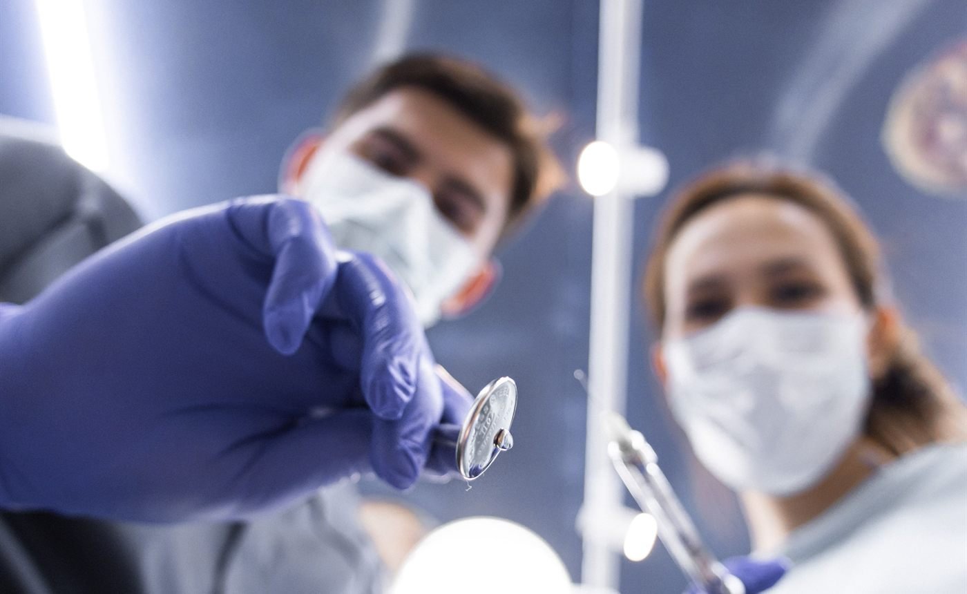 Surgeons operating in the maxillofacial surgical suite